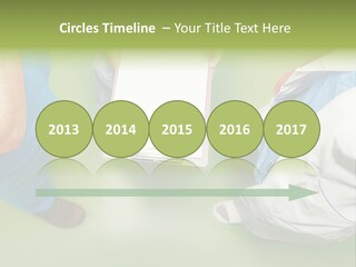 A Group Of People Standing Around A Binder PowerPoint Template