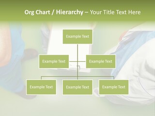 A Group Of People Standing Around A Binder PowerPoint Template