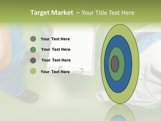 A Group Of People Standing Around A Binder PowerPoint Template