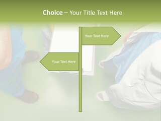 A Group Of People Standing Around A Binder PowerPoint Template