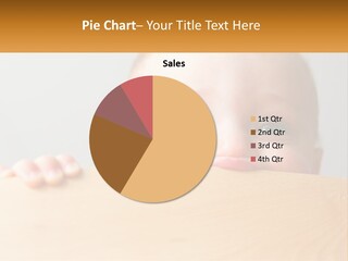 A Baby Is Peeking Over A Wooden Table PowerPoint Template