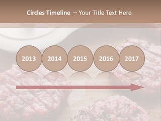 Hamburger Patties On A Cutting Board With A Knife PowerPoint Template