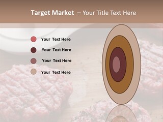 Hamburger Patties On A Cutting Board With A Knife PowerPoint Template