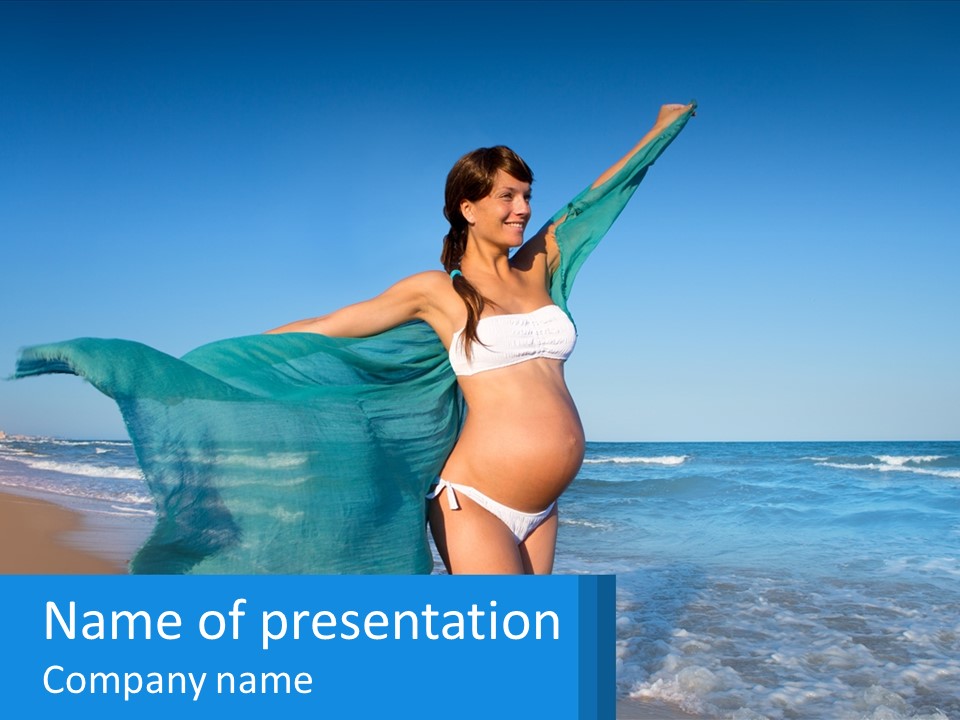 A Pregnant Woman In A Bikini Standing On The Beach PowerPoint Template