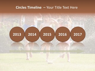 A Group Of Kids Playing In A Sprinkle Of Water PowerPoint Template