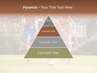 A Group Of Kids Playing In A Sprinkle Of Water PowerPoint Template