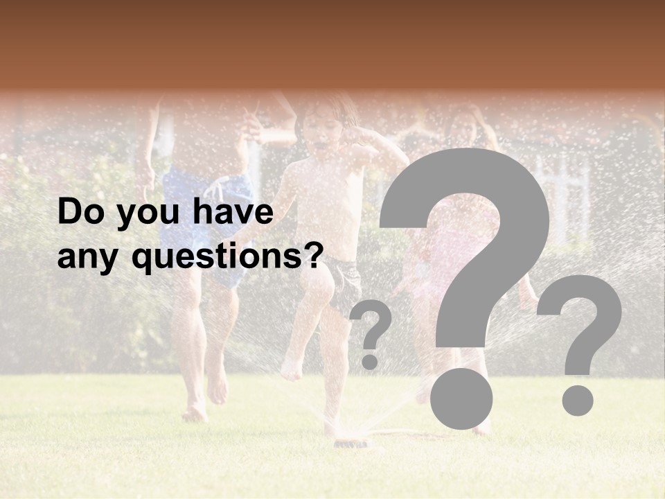 A Group Of Kids Playing In A Sprinkle Of Water PowerPoint Template