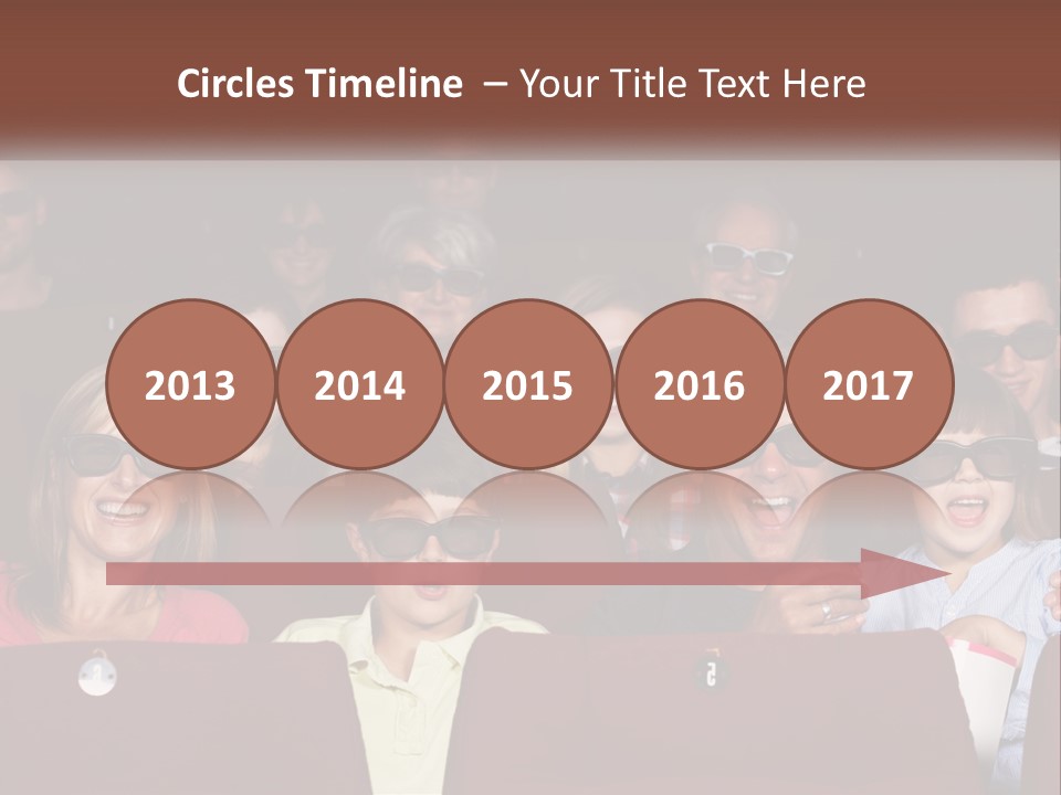 A Group Of People Sitting In A Movie Theater PowerPoint Template