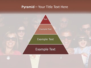 A Group Of People Sitting In A Movie Theater PowerPoint Template