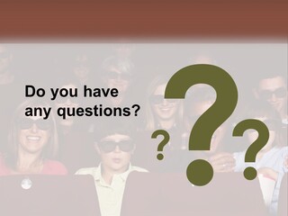 A Group Of People Sitting In A Movie Theater PowerPoint Template