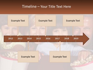 A Family Is Watching A Movie In A Theater PowerPoint Template