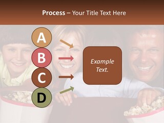 A Family Is Watching A Movie In A Theater PowerPoint Template