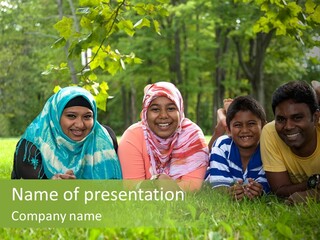 A Group Of People Laying On Top Of A Lush Green Field PowerPoint Template