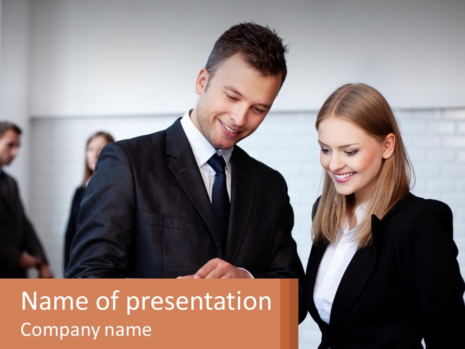 A Man And A Woman Looking At Something On A Table PowerPoint Template