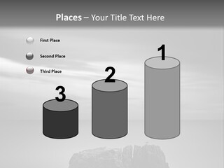 A Black And White Photo Of A Rock In The Ocean PowerPoint Template