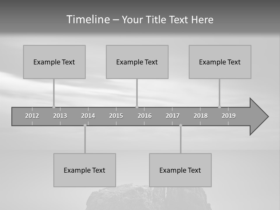 A Black And White Photo Of A Rock In The Ocean PowerPoint Template