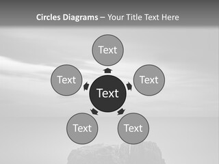 A Black And White Photo Of A Rock In The Ocean PowerPoint Template