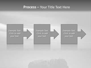 A Black And White Photo Of A Rock In The Ocean PowerPoint Template