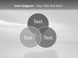 A Black And White Photo Of A Rock In The Ocean PowerPoint Template