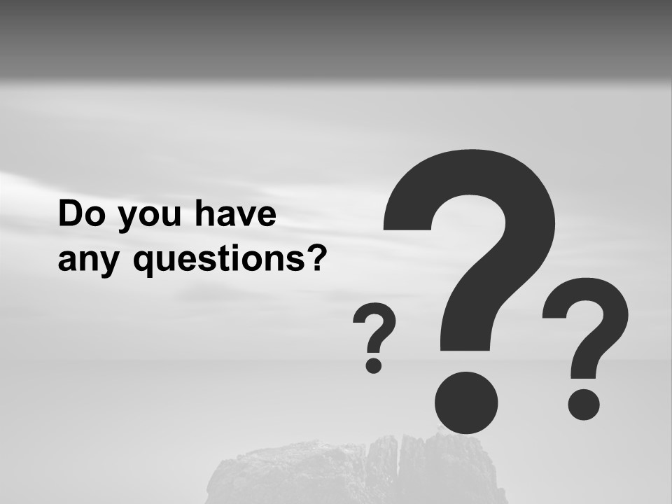 A Black And White Photo Of A Rock In The Ocean PowerPoint Template