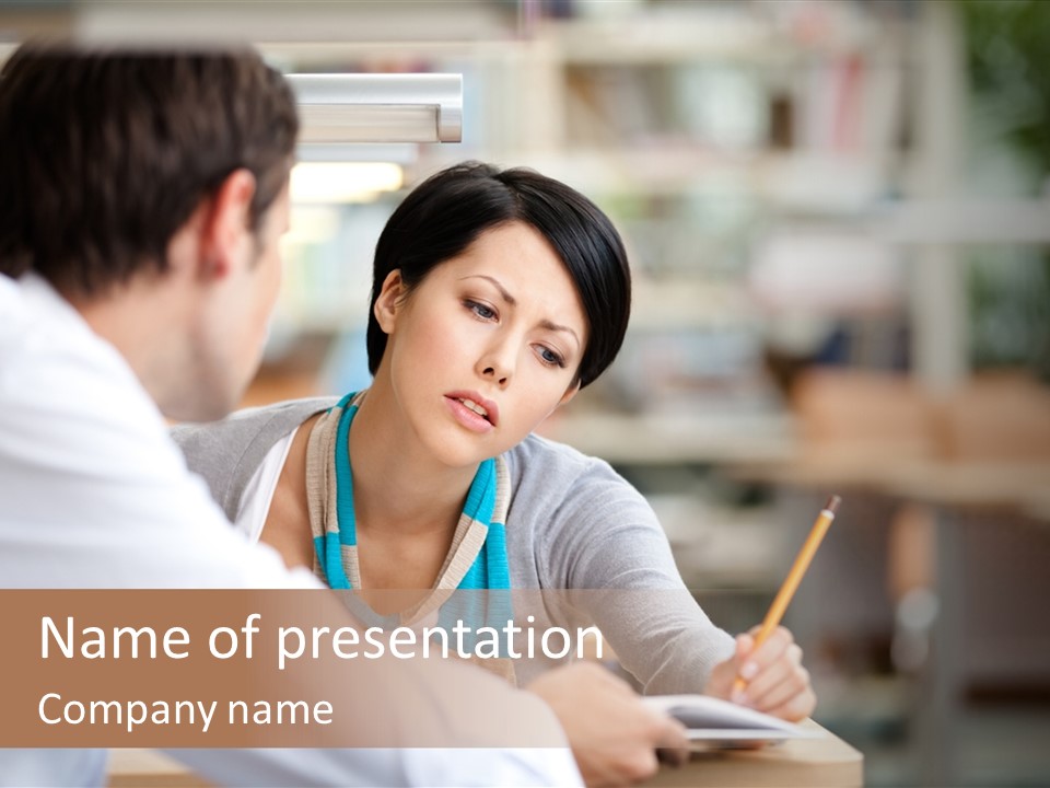 A Woman Sitting At A Desk With A Man PowerPoint Template