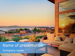 A Balcony With A Table, Couches And A View Of The Water PowerPoint Template