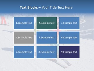 A Group Of People Riding Skis Down A Snow Covered Slope PowerPoint Template