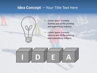 A Group Of People Riding Skis Down A Snow Covered Slope PowerPoint Template