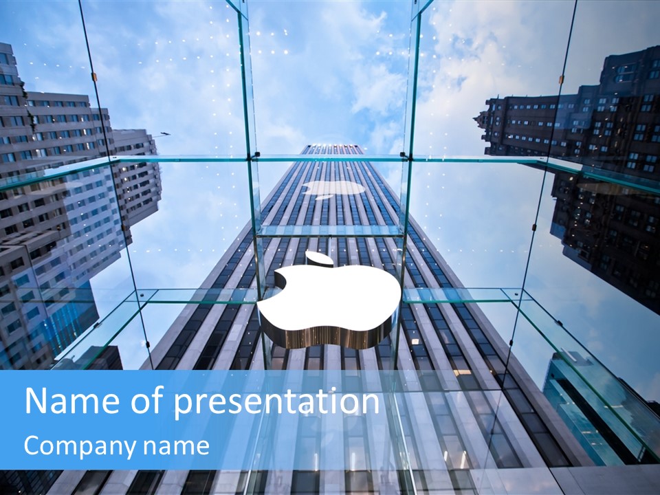 An Apple Logo Is Reflected In A Glass Building PowerPoint Template