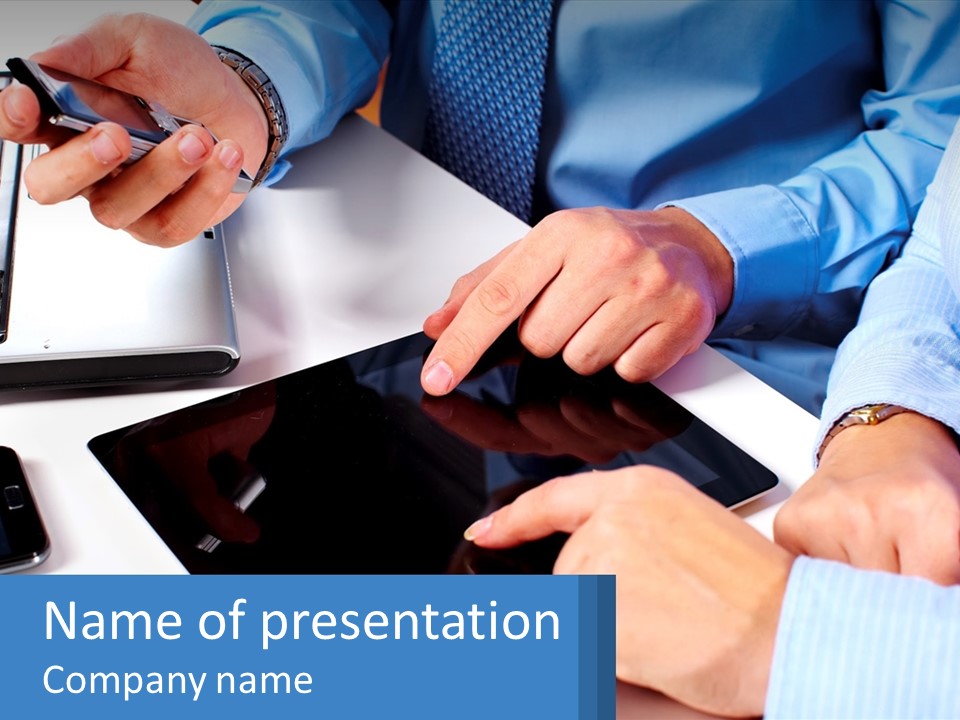 A Group Of People Sitting Around A Table With A Tablet PowerPoint Template