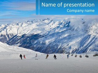 A Group Of People Riding Skis On Top Of A Snow Covered Slope PowerPoint Template