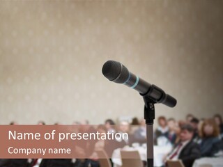 A Microphone In Front Of A Group Of People PowerPoint Template