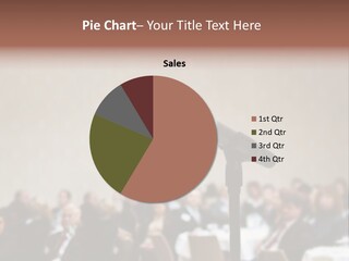 A Microphone In Front Of A Group Of People PowerPoint Template