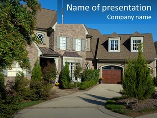 A House With A Driveway And Trees In Front Of It PowerPoint Template