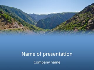 A Scenic View Of Mountains With A Road Going Through Them PowerPoint Template