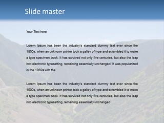 A Scenic View Of Mountains With A Road Going Through Them PowerPoint Template