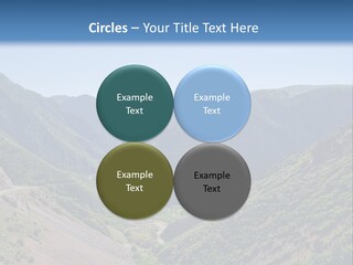 A Scenic View Of Mountains With A Road Going Through Them PowerPoint Template