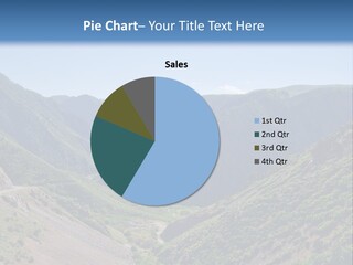 A Scenic View Of Mountains With A Road Going Through Them PowerPoint Template