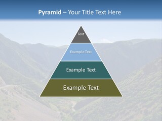 A Scenic View Of Mountains With A Road Going Through Them PowerPoint Template