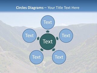 A Scenic View Of Mountains With A Road Going Through Them PowerPoint Template