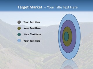 A Scenic View Of Mountains With A Road Going Through Them PowerPoint Template