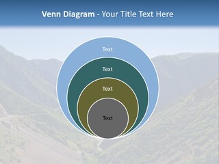 A Scenic View Of Mountains With A Road Going Through Them PowerPoint Template