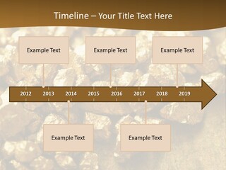 A Pile Of Gold Nuggets On A Table PowerPoint Template