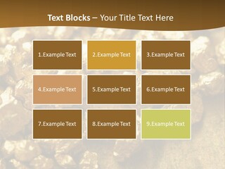 A Pile Of Gold Nuggets On A Table PowerPoint Template