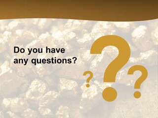 A Pile Of Gold Nuggets On A Table PowerPoint Template