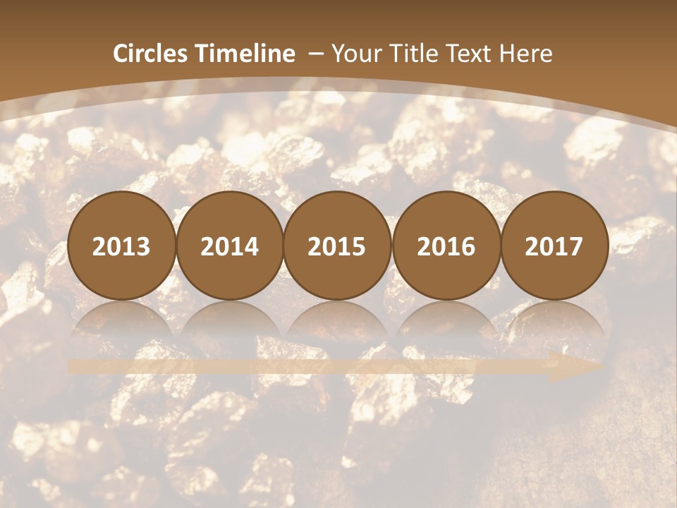 A Pile Of Gold Nuggets On A Wooden Surface PowerPoint Template