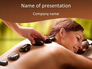 A Woman Getting A Hot Stone Massage At A Spa PowerPoint Template