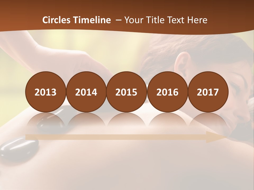 A Woman Getting A Hot Stone Massage At A Spa PowerPoint Template