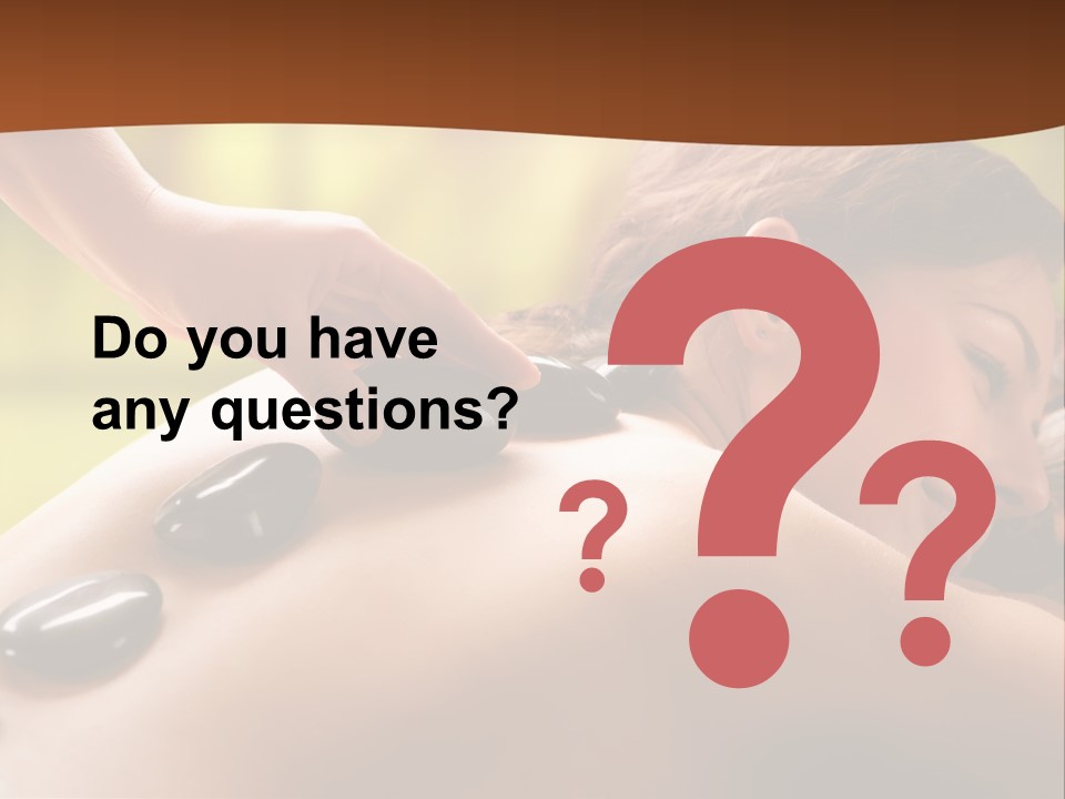 A Woman Getting A Hot Stone Massage At A Spa PowerPoint Template