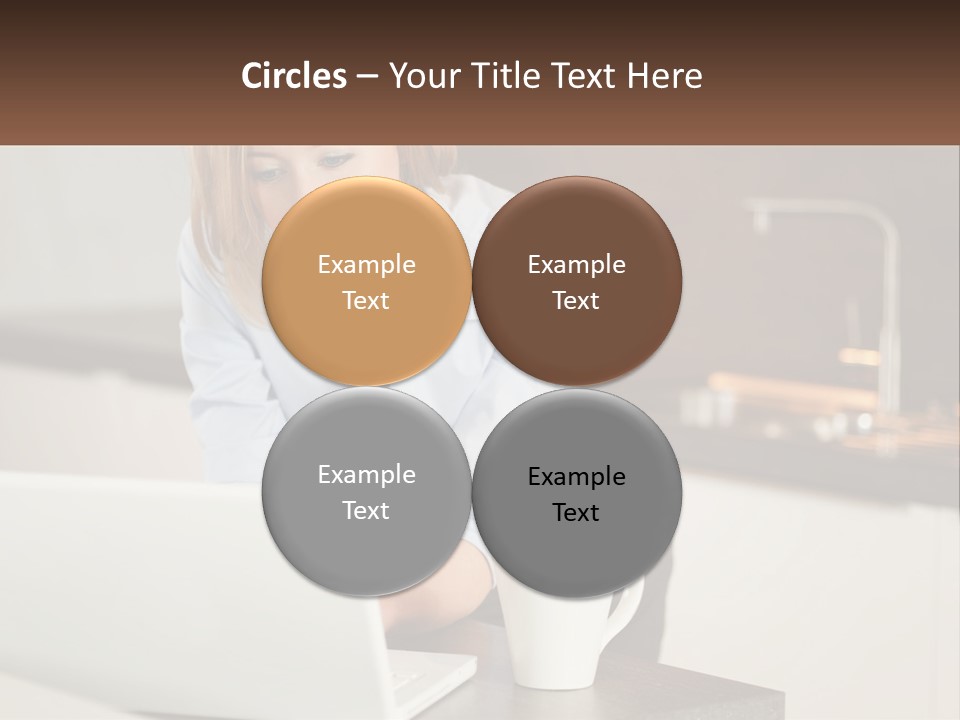 A Woman Sitting At A Table Using A Laptop Computer PowerPoint Template